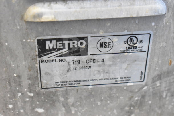 Metro 519-CFC-4 Heated Holding Cabinet label, includes NSF and UL listings, 2000W, made in USA. Visible wear on surface.