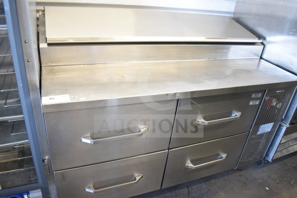 Commercial pizza prep table with 4 drawers, stainless steel, on casters, 115 volts, 1 phase, excellent condition.