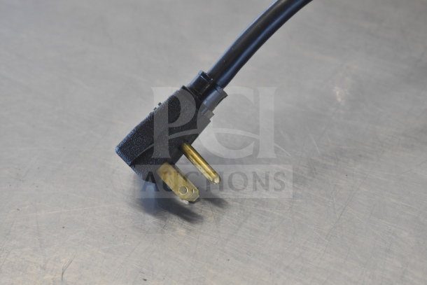 Alt text: Commercial pizza prep table plug, 115 volts, 1 phase, shown on metallic surface.