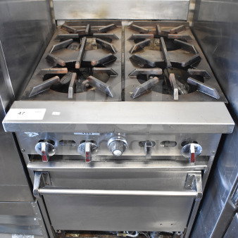 Commercial gas-powered 4 burner range with oven, stainless steel, used condition, visible control knobs, item tag "47".