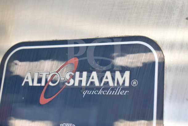 Alto Shaam QC40C-2M-ADS-HL logo on stainless steel surface, indicating brand of commercial blast chiller.