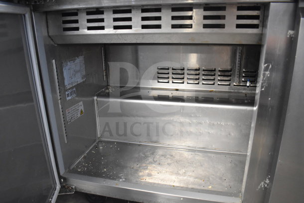 Avantco 178SSPT60MHC commercial sandwich salad prep table, stainless steel interior, slightly worn, 115V, 1 phase.