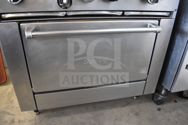 Garland SunFire commercial 6 burner gas range with oven, salamander cheese melter, and overshelf. Stainless steel finish.