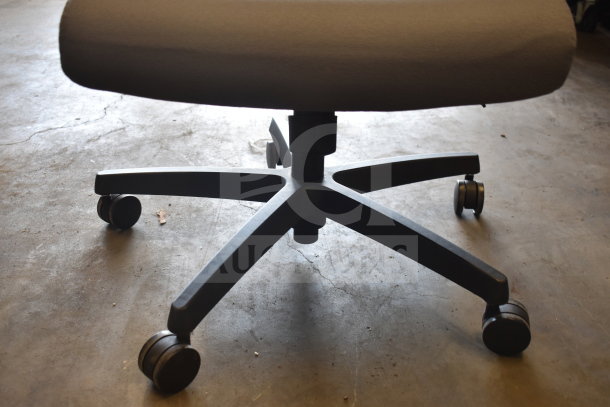 Gray office chair on casters, sturdy black base, good condition. Part of a lot of 16 chairs, bid multiplied by 16.