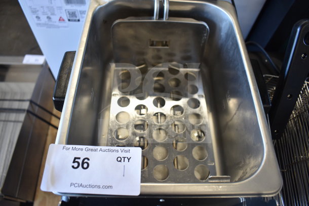 Brand new Waring WDF75RC 8.5 lb. Commercial Countertop Deep Fryer, 120V, 1 Phase. Shows minor scratches. Auction tag visible.