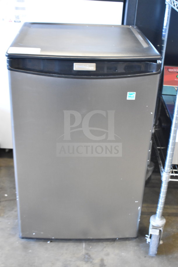 Brand new Danby DAR044A4BSLDD mini cooler, 115 volts, scratch and dent condition, visible logo, front view.