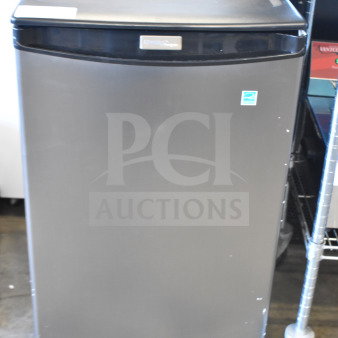 Brand new Danby DAR044A4BSLDD mini cooler, 115 volts, scratch and dent condition, visible logo, front view.