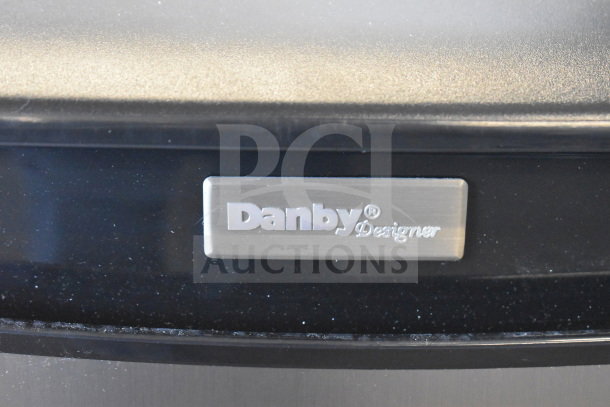 BRAND NEW SCRATCH AND DENT! Danby DAR044A4BSLDD Mini Cooler, tag shows Danby Designer logo, 115 volts, 1 phase.