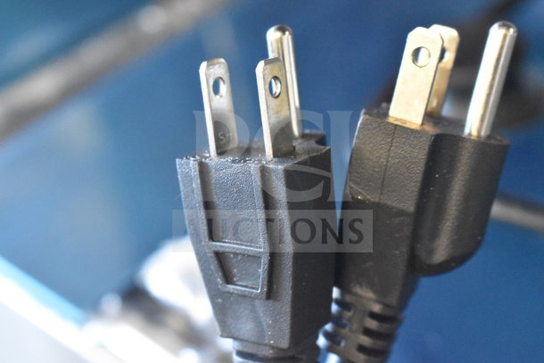 Close-up of a power plug for the 2025 Carnival King 382WSM22 non-stick double waffle maker.