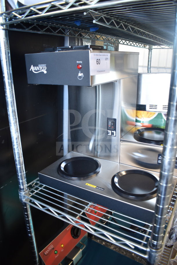 Brand new Avantco 177C30 pourover coffee maker with 3 warmers, 120 volts, with minor scratches and dents, on shelf.