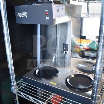 Brand new Avantco 177C30 pourover coffee maker with 3 warmers, 120 volts, with minor scratches and dents, on shelf.