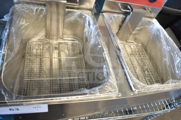 Brand new Avantco 177F102 dual tank electric countertop fryer, 20 lb. capacity, plastic-wrapped, with dual fry baskets.