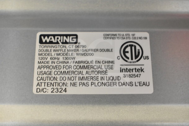 2023 Waring WWD200 Double Waffle Maker tag showing model, 120V, commercial use approval, 1300W, and safety warnings.