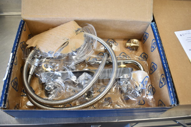 BRAND NEW SCRATCH AND DENT T&S B-1172 faucet, chrome finish, flexible hoses, in original packaging with visible minor wear.