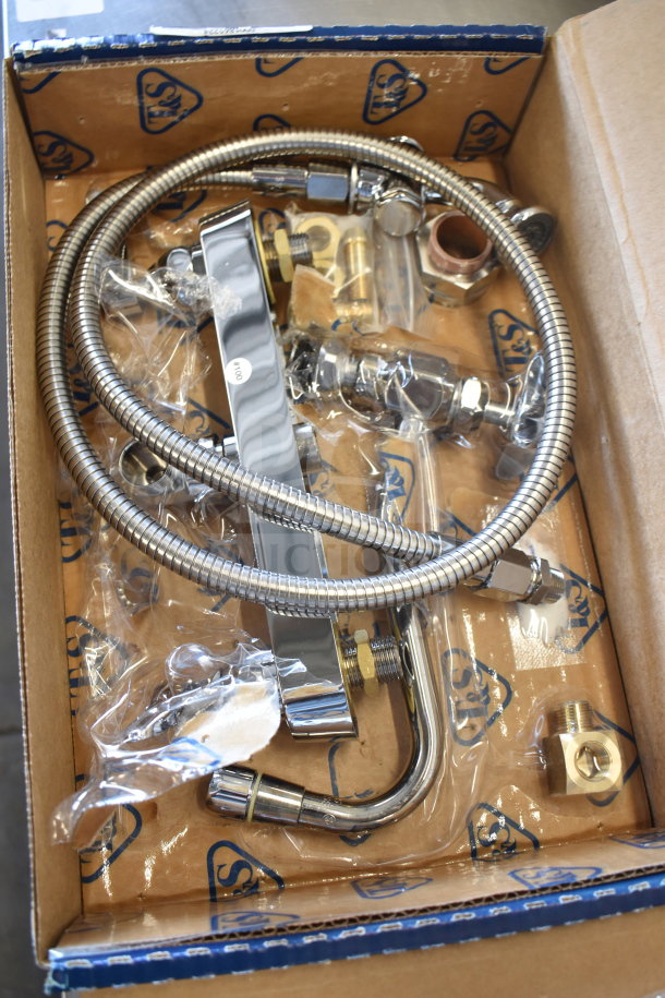 Brand new T&S B-1172 Faucet, scratch and dent, includes hoses and fittings, visible packaging logos, in box.