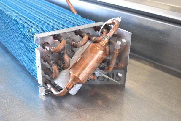 Brand new Avantco 17816485HC evaporator coil with minor scratches, copper tubing, and protective foam for A-49R-HC models.
