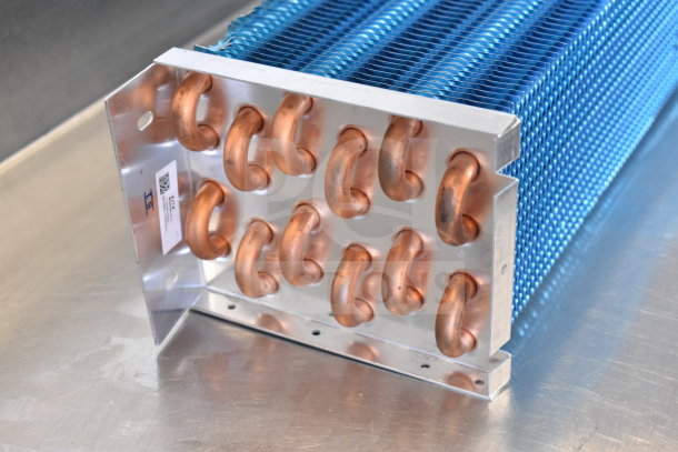 BRAND NEW Avantco 17816485HC evaporator coil for A-49R-HC. Slight dents, copper tubing, blue fins, and visible label.