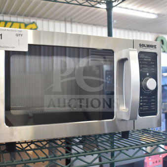 BRAND NEW Solwave 180MW1000D stainless steel commercial microwave, dial control, 120V, slight scratch, model tag visible.