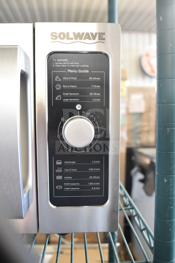 Solwave 180MW1000D stainless steel commercial microwave with dial control, menu guide visible, 120V, brand new with scratches.