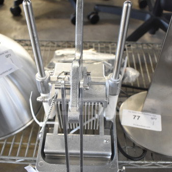 Brand new scratch and dent countertop cooked chicken slicer, stainless steel, manual operation, durable construction.