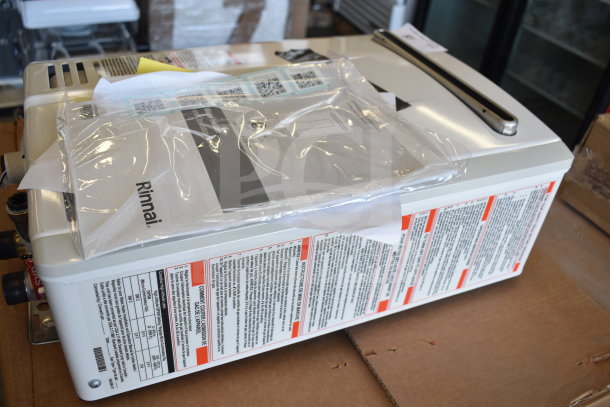Brand new Rinnai V53De gas wall-mounted outdoor tankless water heater, 120V, 120,000 BTU, 5.3 GPM, with minor scratches.