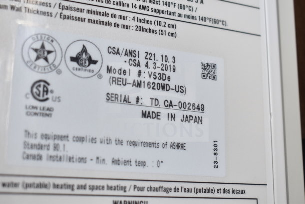 Rinnai V53De gas wall-mounted outdoor tankless water heater label, Model V53De, 120,000 BTU, made in Japan.