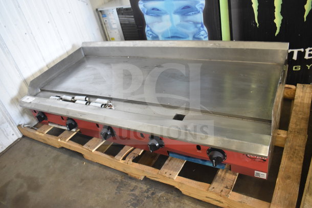 Brand new Avantco 177CAG60 60" commercial gas griddle with thermostatic controls, slight scratches, on wooden pallet.