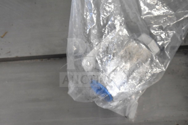 Plastic-wrapped component for an Avantco 177CAG60 griddle, showing product packaging and condition.