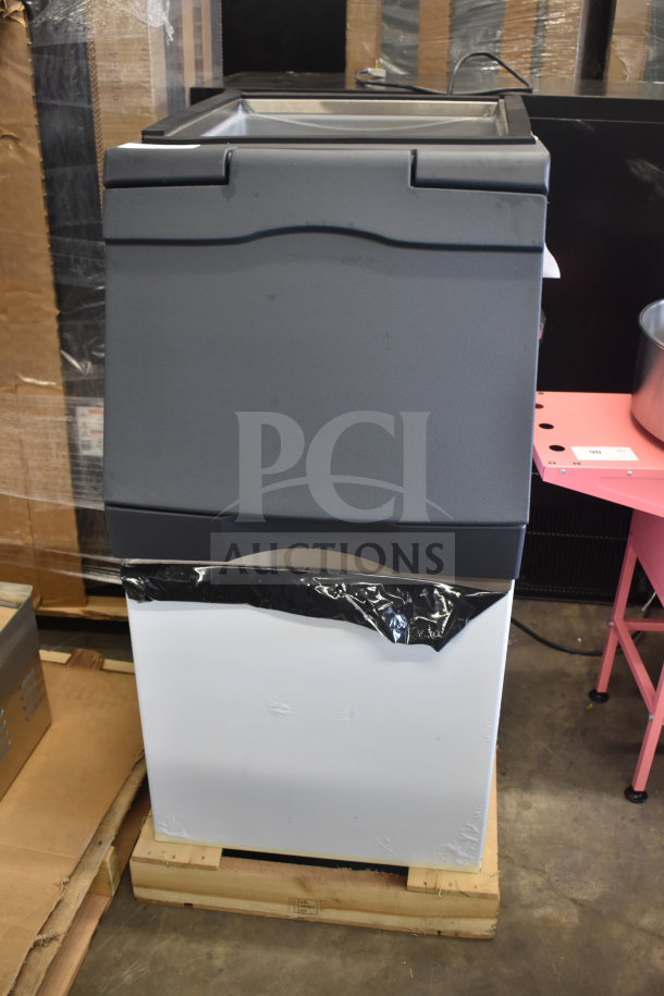 Brand new 2026 Scotsman B322S Ice Storage Bin, 370 lb capacity, stainless steel, minor scratches and dents, on pallet.