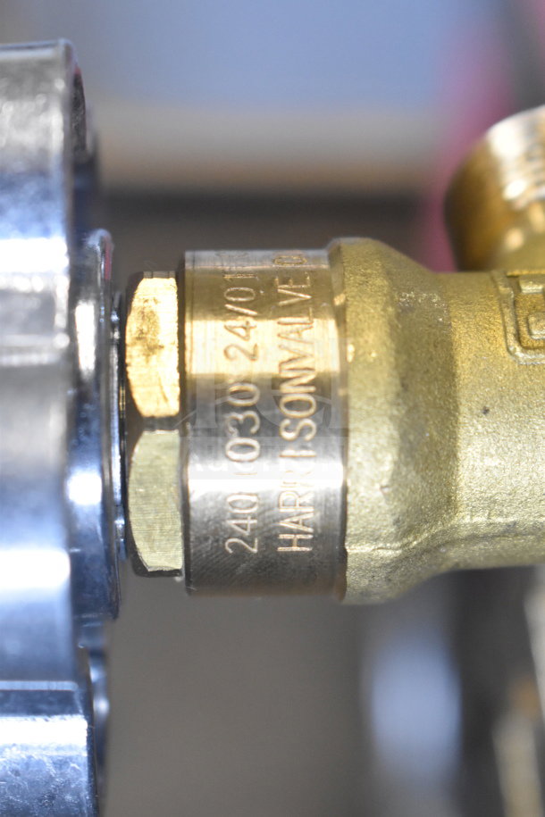 alt="Brand new scratch and dent tank with Micro Matic unit. Close-up of valve showing 'Harrison Valve' and model details."