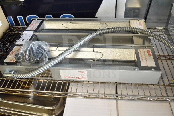 BRAND NEW SCRATCH AND DENT! ServIt 423SW24INHDBLA 24" Double Strip Warmer with dual controls, 120V, 1 phase shown on a shelf.