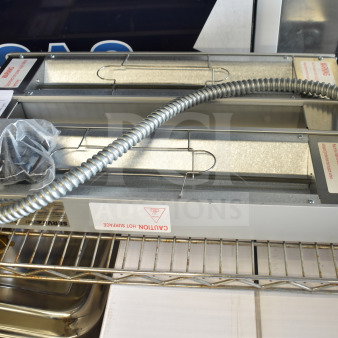 BRAND NEW SCRATCH AND DENT! ServIt 423SW24INHDBLA 24" Double Strip Warmer with dual controls, 120V, 1 phase shown on a shelf.