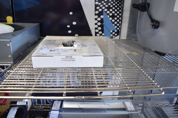 Brand new Robot Coupe 28131 9/16" slicing disc in packaging on metal rack. Scratch and dent condition.