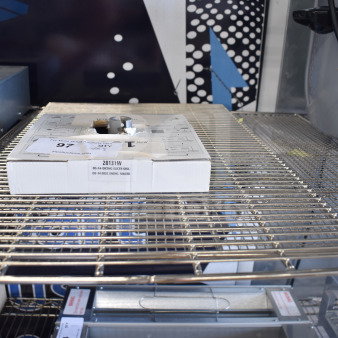 Brand new Robot Coupe 28131 9/16" slicing disc in packaging on metal rack. Scratch and dent condition.