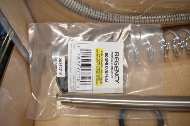 Brand new Regency 600PRD8X pre-rinse faucet, 1.15 GPM, 8" centers, 44" hose, minor scratches, in packaging with label showing model.