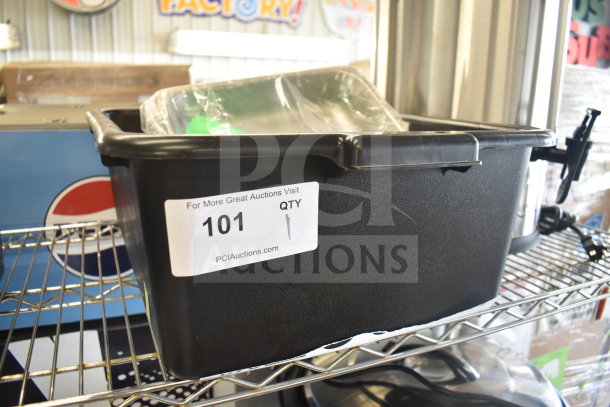 Black plastic tray with a meat grinder attachment, noted as brand new with scratch and dent, item label shows auction info.