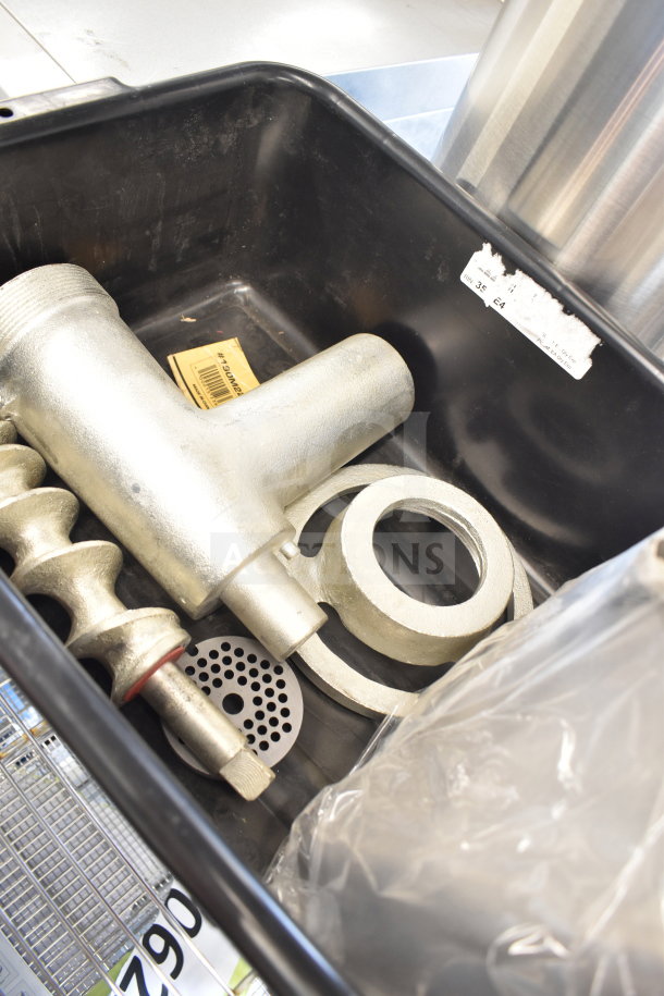 Brand new scratch and dent meat grinder attachment with tray, metal components, visible labels, ideal for kitchen use.