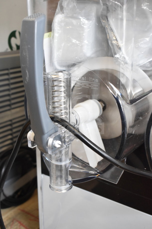 BRAND NEW XRJ15LX2 commercial countertop slushie machine with 2 hoppers, 110 volts, 1 phase, scratch and dent condition.