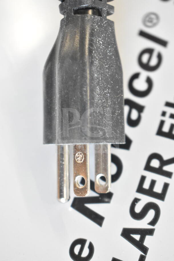 Black and silver power plug for the Cadco XAF003-US OV-003 convection oven. Visible markings for electrical standards.