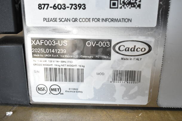 Cadco XAF003-US oven label showing model, 2025L0141239 serial, 120V, made in Italy. NSF, MET certified. Scratches visible.