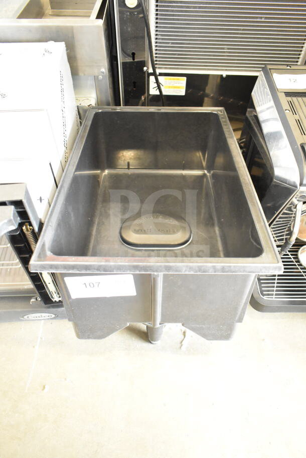 Vollrath food warmer, brand new with minor dents. Black metal body, marked "Always Use With Water." Label indicates item 107.