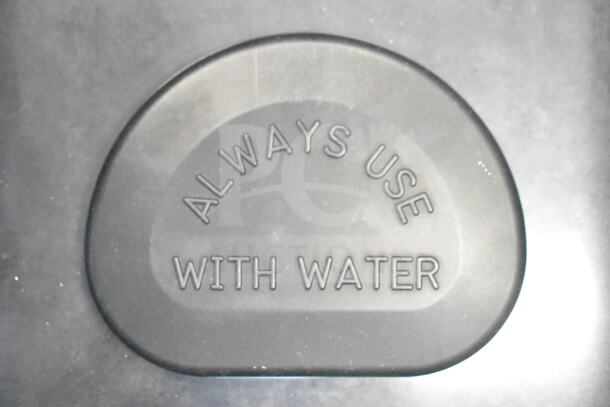 Brand new Vollrath food warmer with scratch and dent. "Always use with water" label visible, indicating usage instructions.