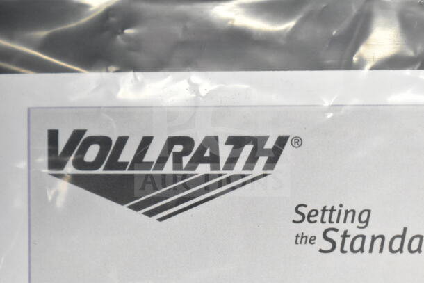 Brand new Vollrath food warmer, minor scratches, visible logo and packaging, high-quality stainless steel construction.