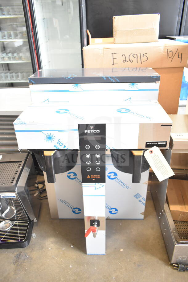 Brand new Fetco CBS-1252 Plus twin automatic coffee brewer with digital controls and plastic brew basket, minor scratches.