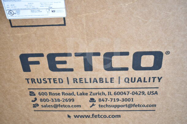 BRAND NEW Fetco CBS-1252 coffee brewer carton, scratches visible. Model and certification labels affixed.