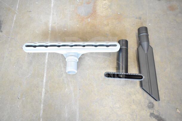 BRAND NEW ProTeam GoFit® 6 Backpack Vacuum attachments, including brush and nozzle, shown on a concrete surface.