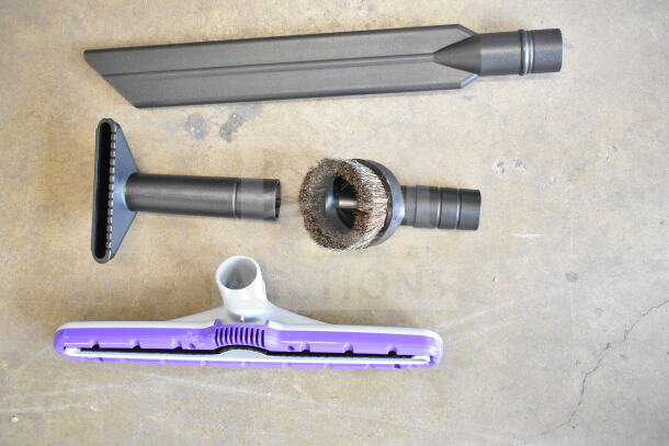 ProTeam GoFit® 6 cordless vacuum accessories, including multi-surface wand and attachments, new with minimal scratches.