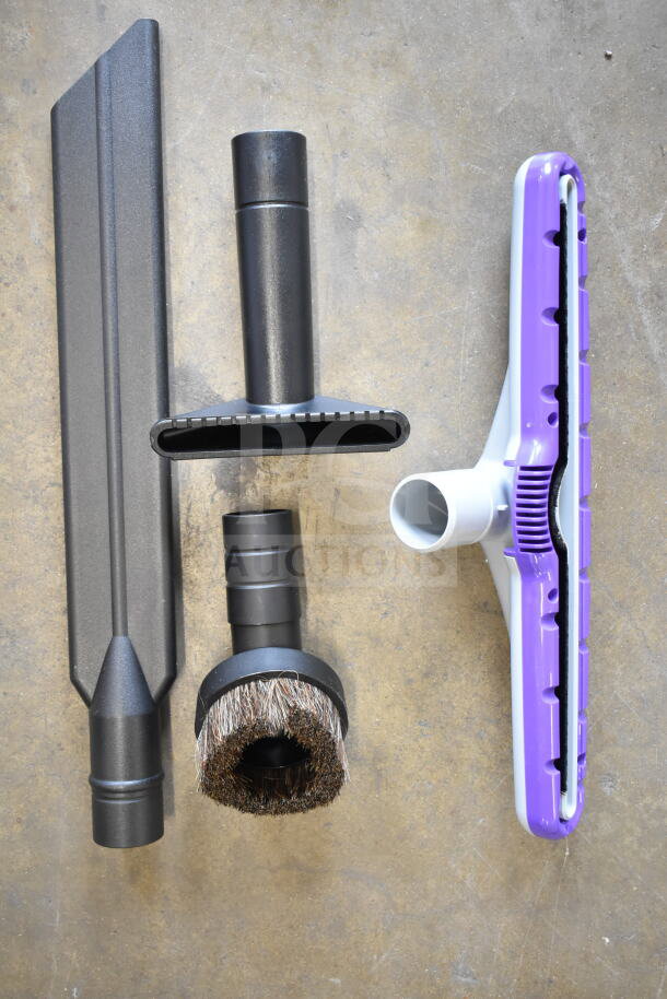 BRAND NEW ProTeam GoFit® 6 Qt. Cordless Backpack Vacuum attachments: crevice tool, brush, floor head, in black and purple.