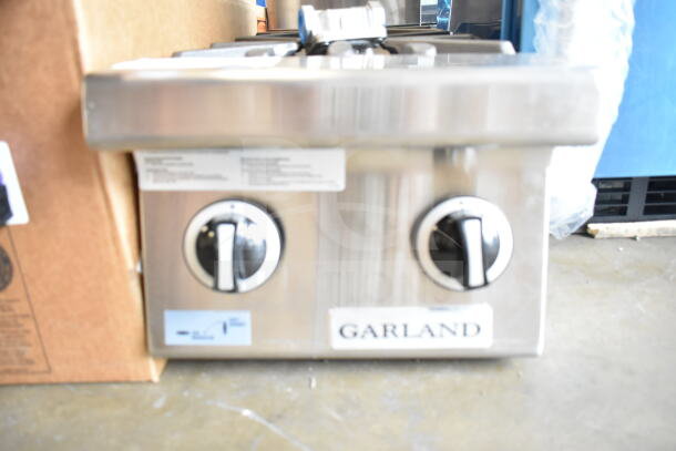 BRAND NEW Garland GTOG12-2 2 Burner 12" Liquid Propane Range, 60,000 BTU, with control knobs visible, scratch and dent condition.