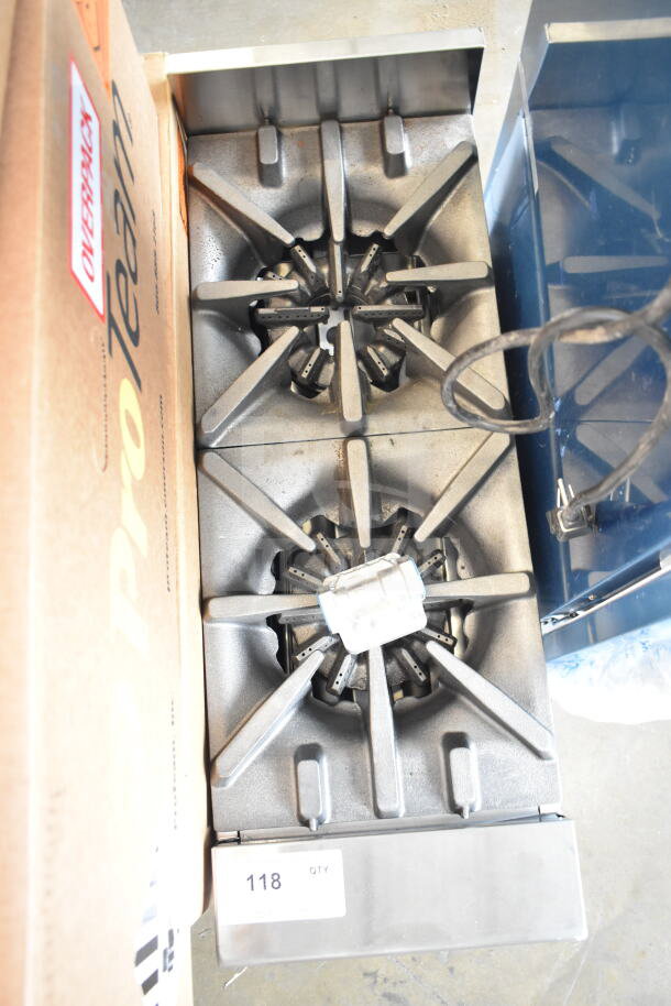 Brand new Garland GTOG12-2 countertop range, 2 burners, 60,000 BTU, liquid propane, minor scratches, item 118 tag visible.